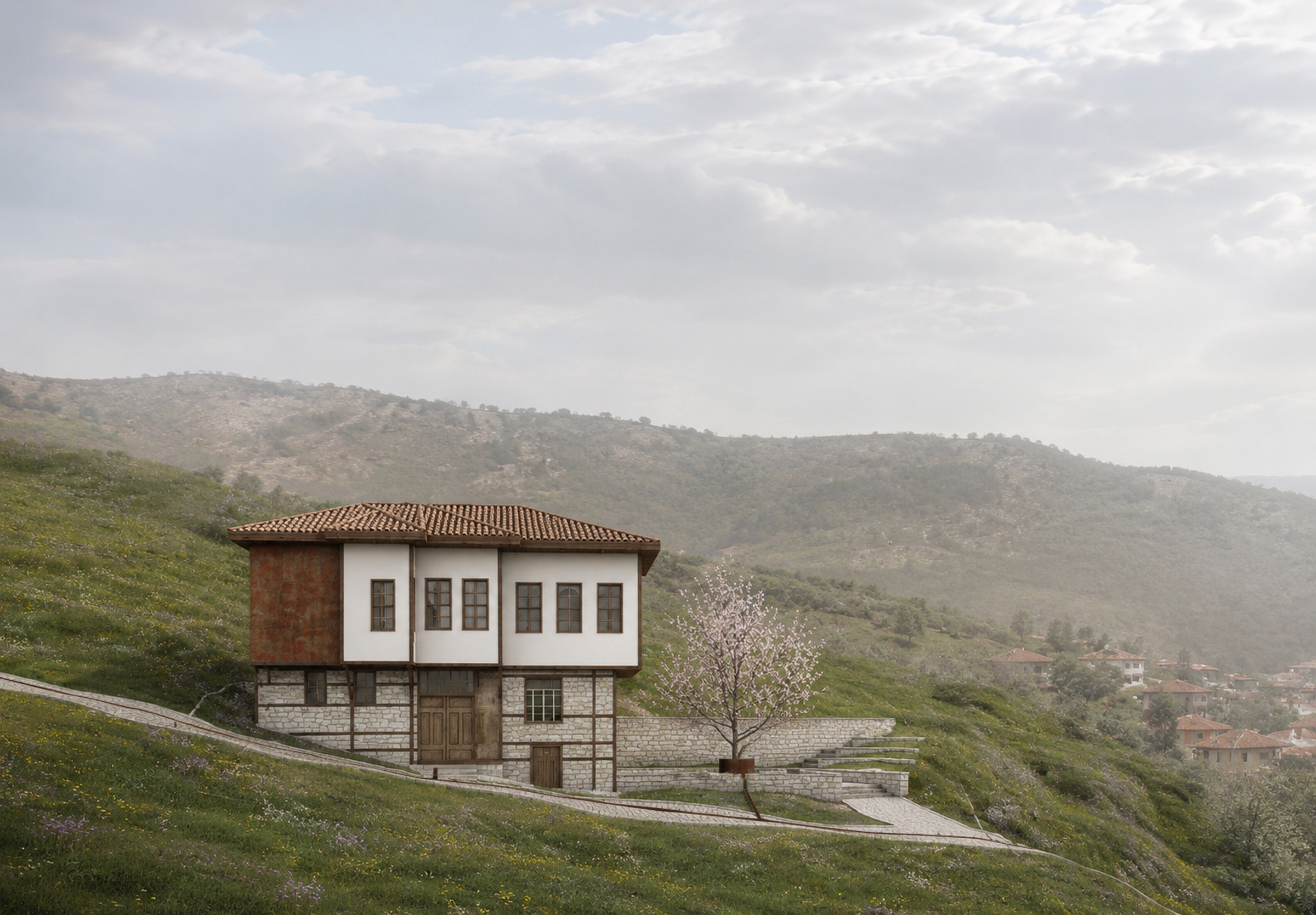Motif Evi'nin Uluborlu vadisine bakan genel görünümü; kırma çatı, beyaz sıvalı üst kat ve taş istinat duvarlarıyla teraslanan bahçe